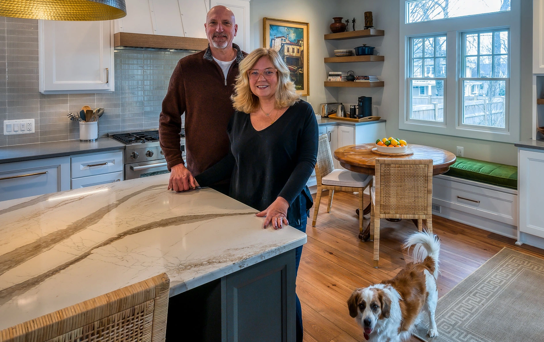 Foster's Remodeling clients in their new remodeled kitchen