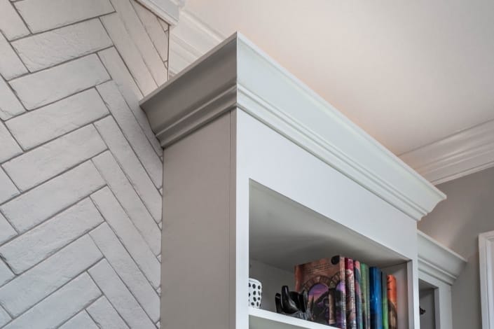 Fireplace wall, interior remodeling, Fairfax, VA, built-in shelving next to Chevron wall
