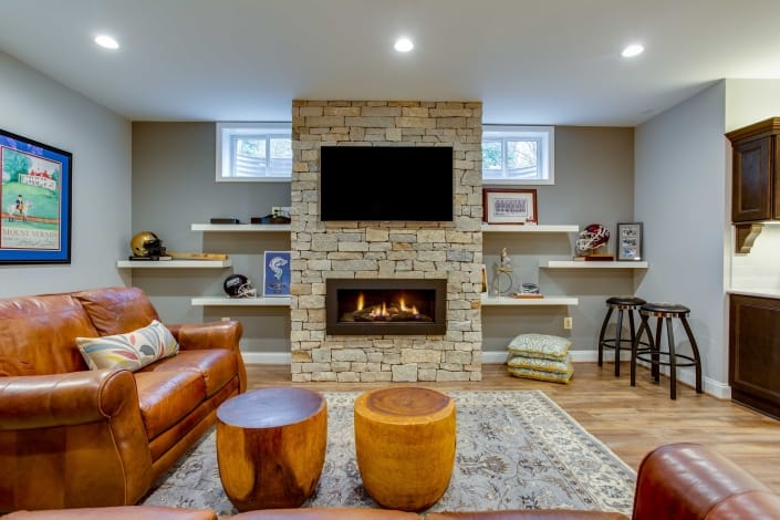 Basement suite, remodeling TV mounted on Pine County Ledger stone fireplace