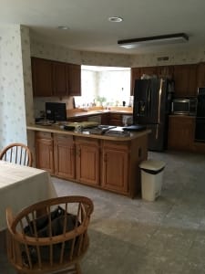 woodbridge kitchen remodel with gray tile floors and 70's style cabinets before photo