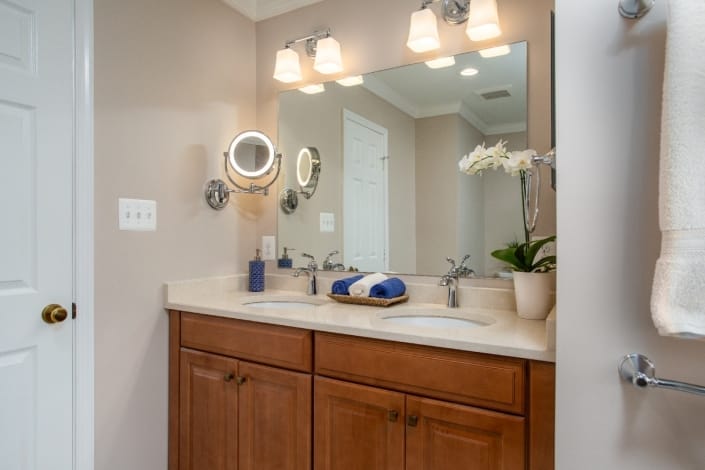 Woodbridge Master Bathroom Remodel with double sided polished chrome make-up mirror
