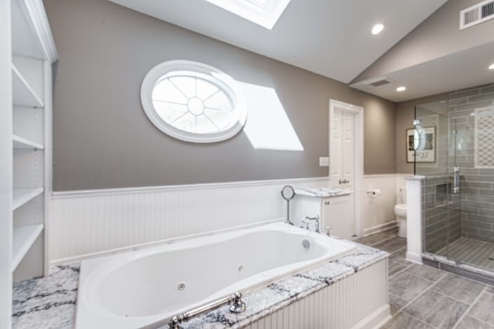 Fairfax Station Master Bath Remodel featuring Mirabelle Key West soaking tub with Cambria Seagrove tub deck