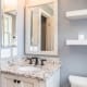 Rustic bathroom remodel in Arlington with custom vanity and mirror