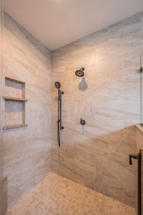 spacious shower enclosure bathroom remodel in Haymarket with light brown 12x24 tile