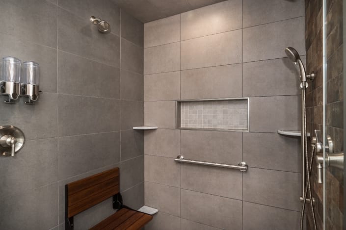 Master suite remodel Alexandria, VA interior shower with large gray tile shower walls