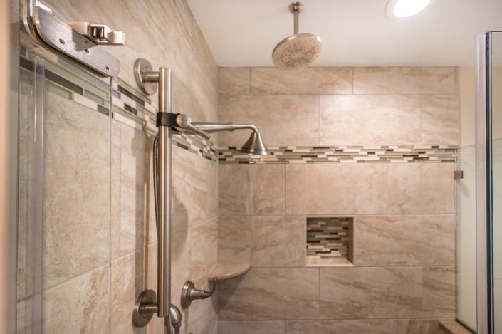 fairfax station bathroom remodel features Kohler Forte shower fixture Ivory tile shower walls