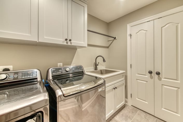 Vienna laundry room remodel with crystal cabinets