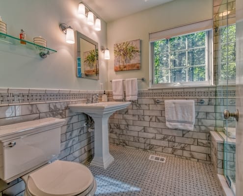 Falls Church Bathroom Remodel featuring basketweave Carrara marble tile