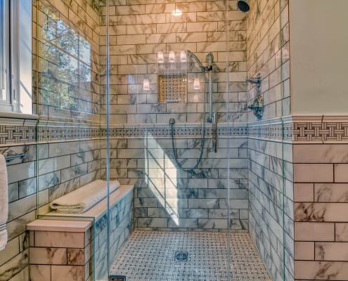 Falls Church Bathroom Remodel with Enchant Florida tile walls and Carrara Basketweave chair rail