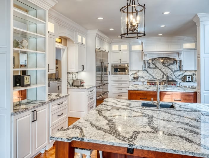 Stunning, gourmet, kitchen remodel, Haymarket, VA, featuring Cambria quartz countertops, custom cabinets and shelving in white and cherry cabinets