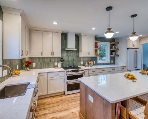 Fairfax, VA kitchen remodeling with wood tone island alongside white Crystal cabinetry