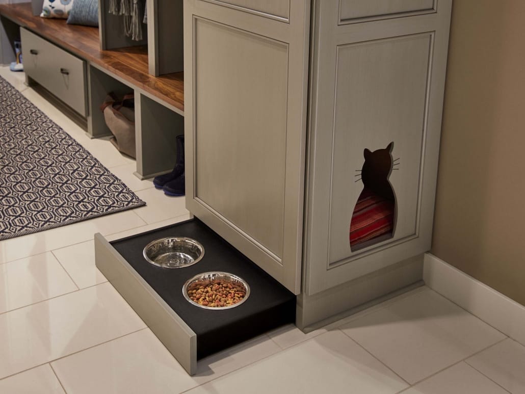A cat closet made by Crystal Cabinets with pull out feeding station
