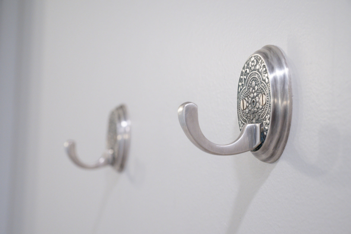 detailed robe hangers in newly remodeled bathroom