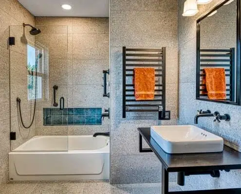 Arlington Bath remodel Industrial chic with metal features and stone walls