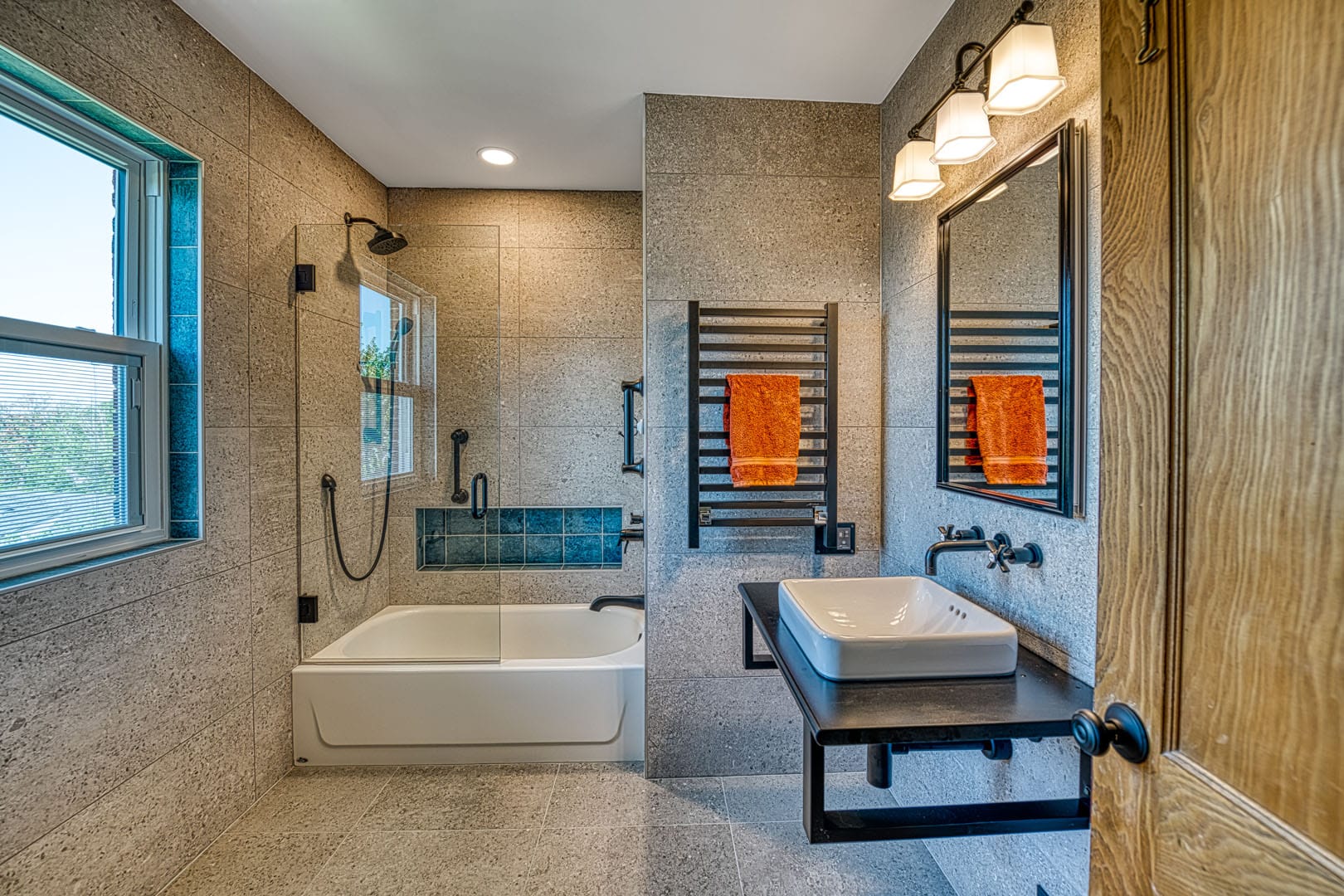 Custom Bath remodeling Arlington VA with oil rubbed bronze fixtures and a towel warmer