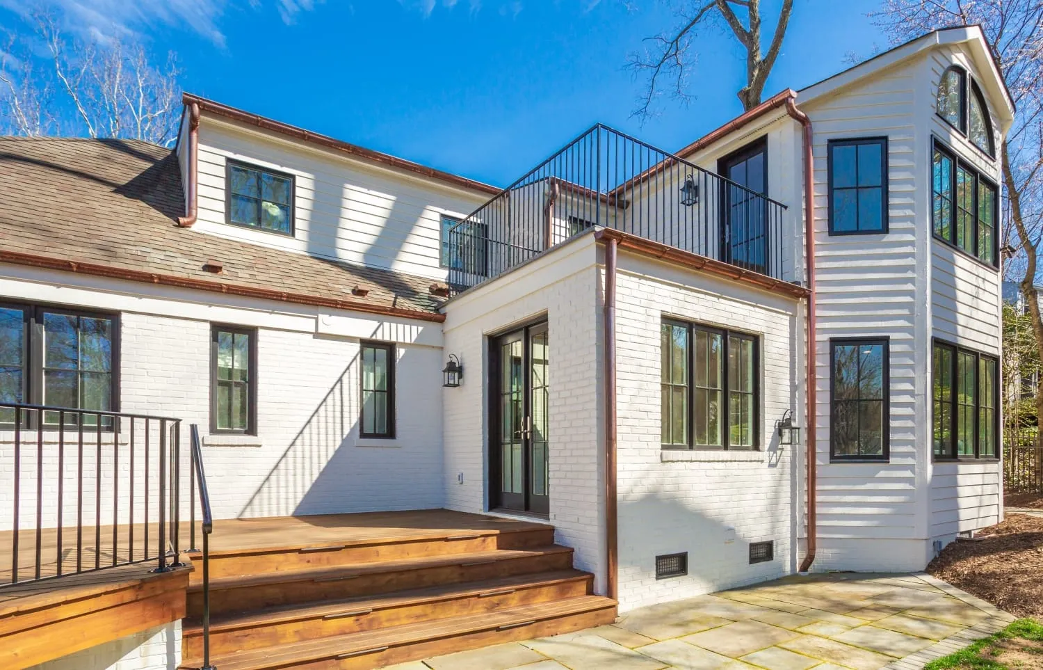  Arlington custom home addition with new decking and iron rail system and roof deck 