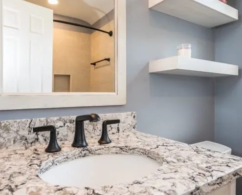  Bathroom remodel featuring granite countertop and oil rubbed bronze fixtures 