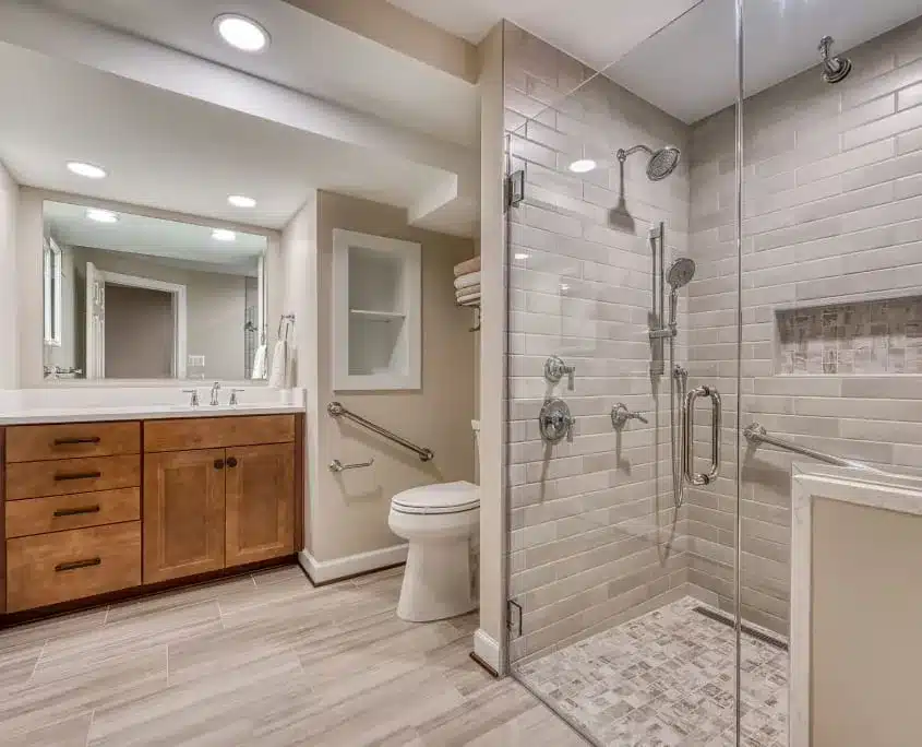 Springfield basement remodel with new bathroom. Shower with glass door, ceramic tile and flooring and new vanity