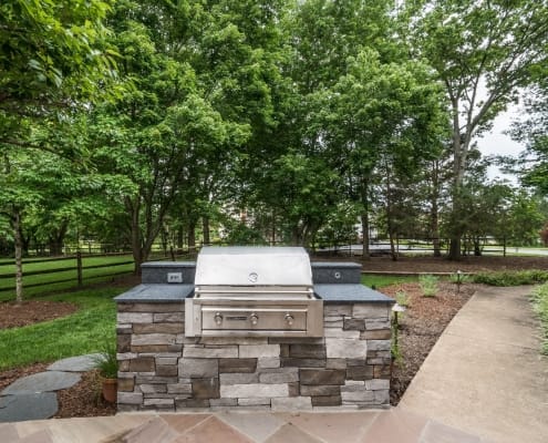 Patio and outdoor grilling area with stacked brick custom grill counter