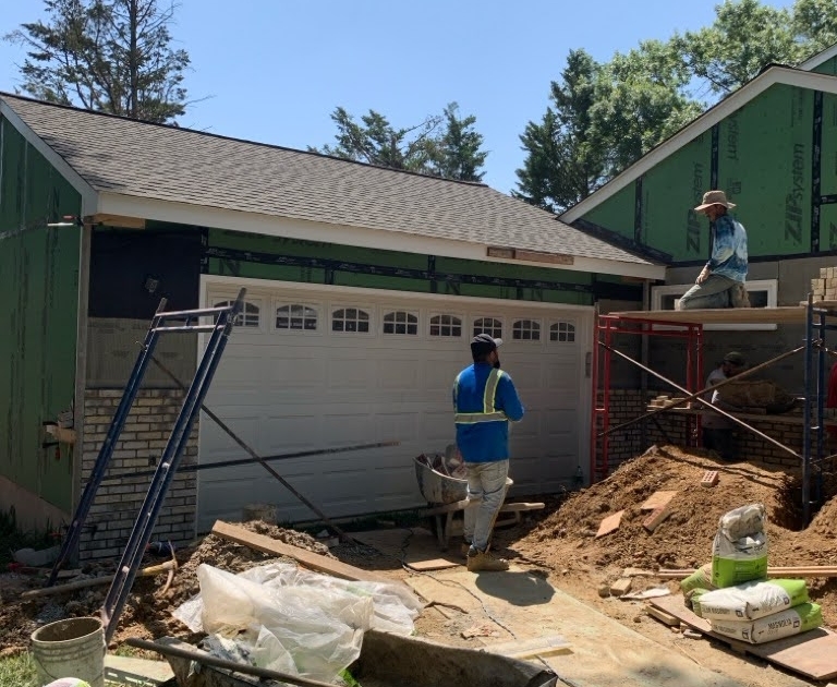 contractors working on garage addition