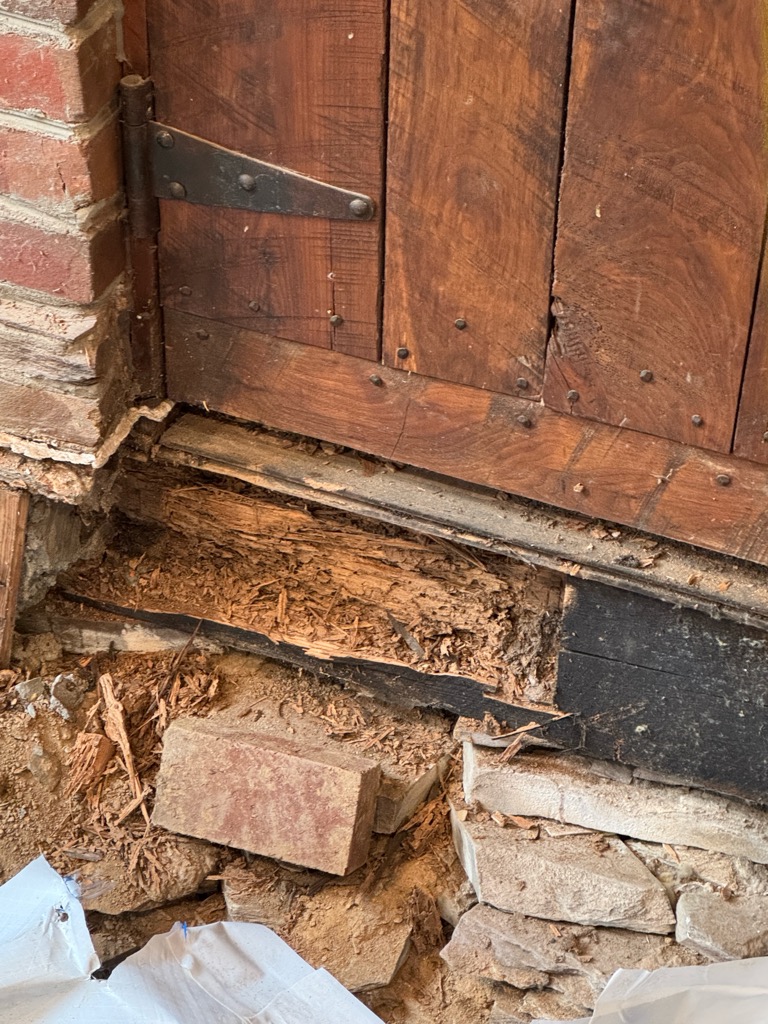 rotting wood under doorway